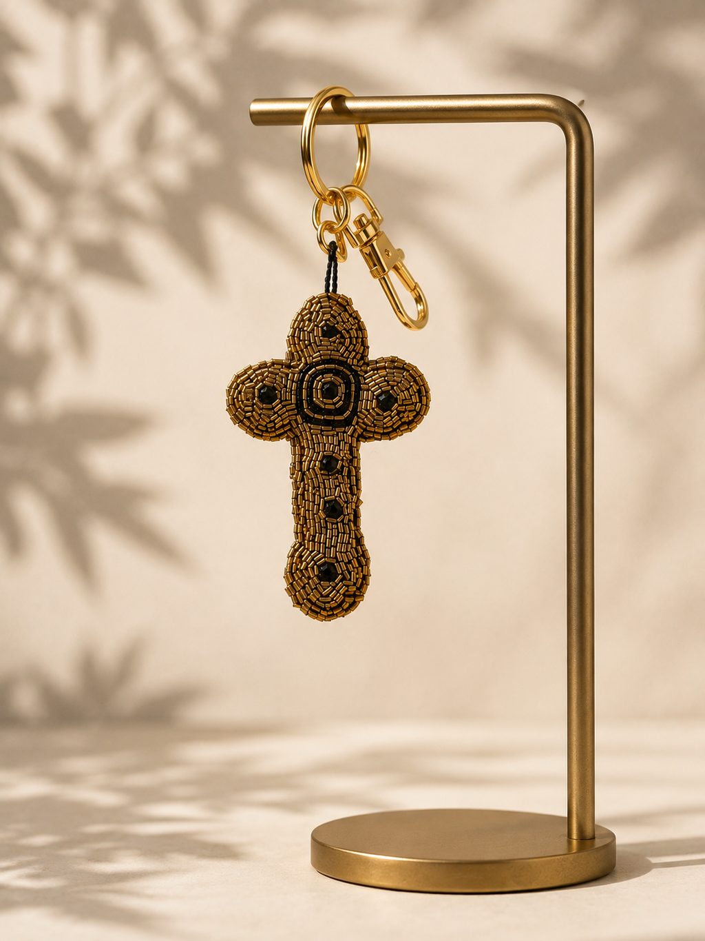 Auralis Charm - beaded cross charm hanging from silver-tone clasp