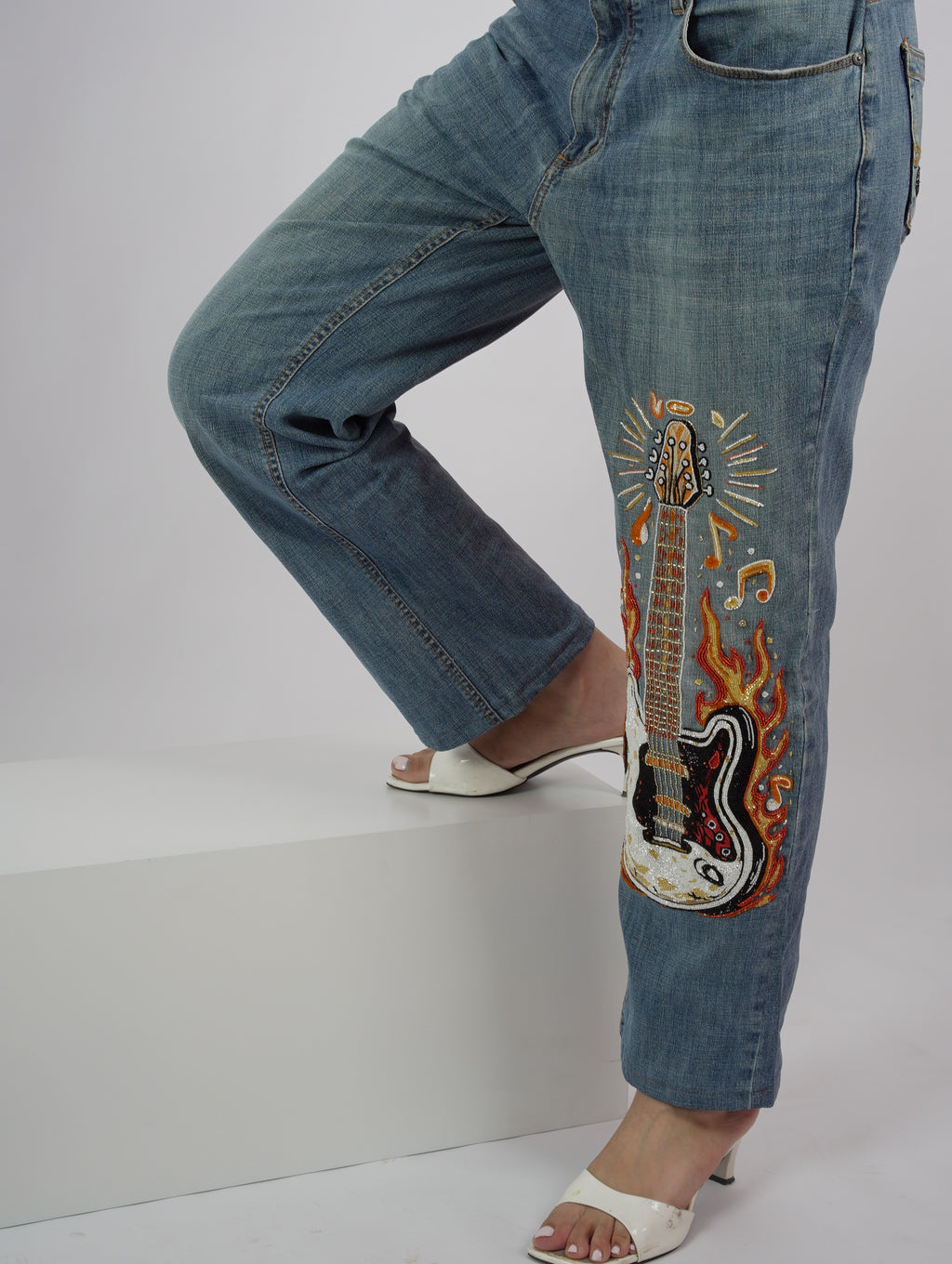 Burning Strings Denim embroidery close-up – flame threadwork embroidery