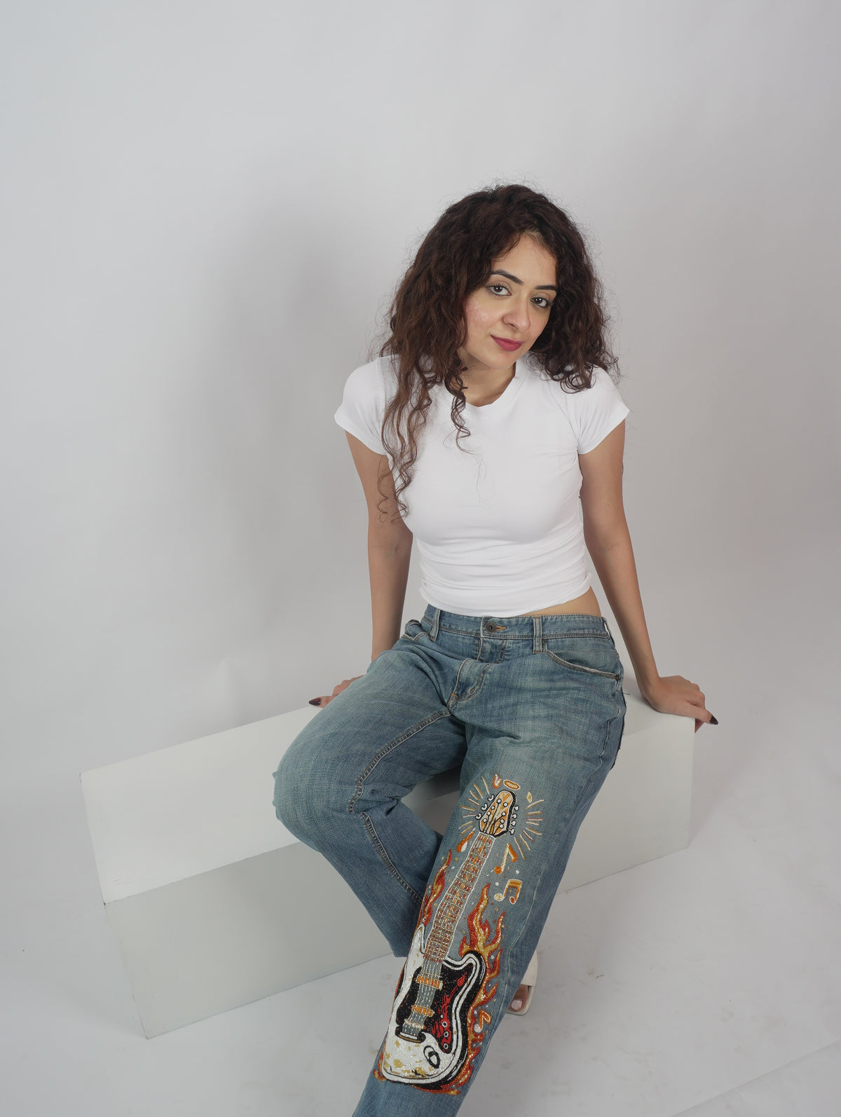 Burning Strings Denim front view – embroidered flame denim jeans