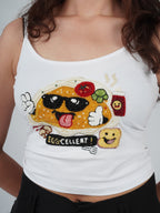 Close-up of hand embroidery on the white EGGZAA Top