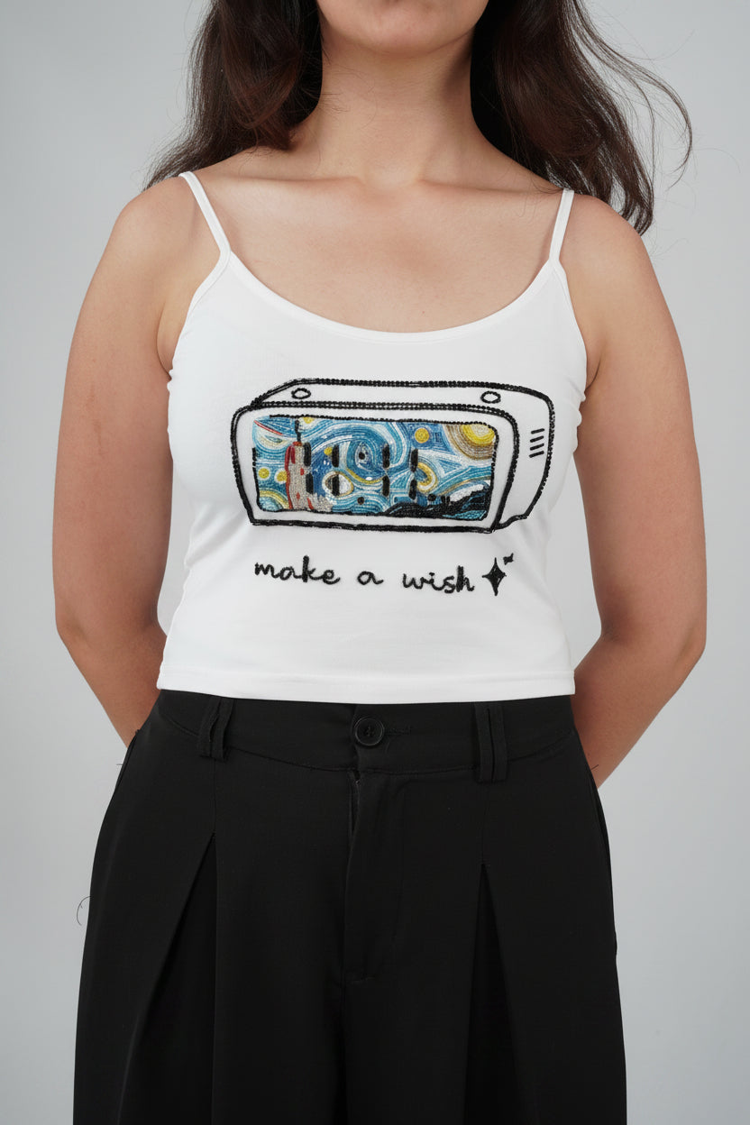Close-up of intricate hand embroidery on the ELEVEN Make a Wish Top