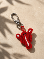 Beaded red lobster charm with white stripe detail