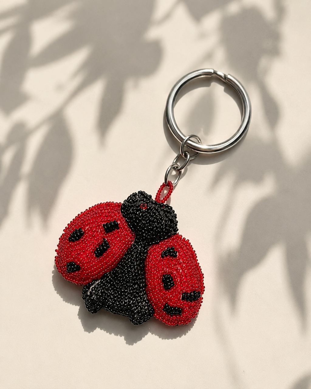 Beaded red ladybug charm with black spots