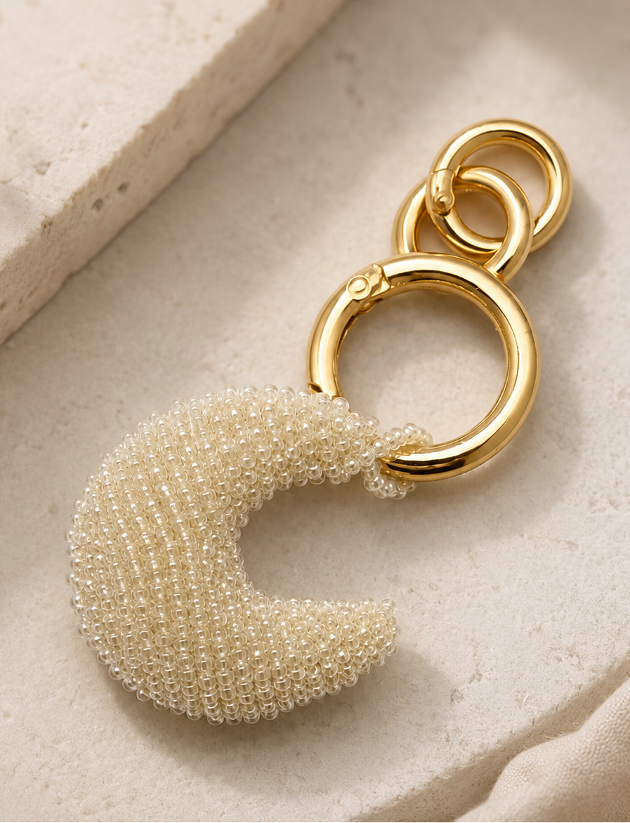 Pearl-white beaded crescent moon charm