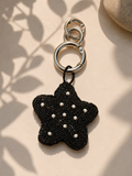 Black beaded star charm with pearl accents