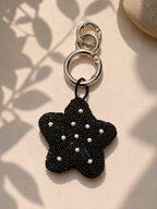 Black beaded star charm with pearl accents