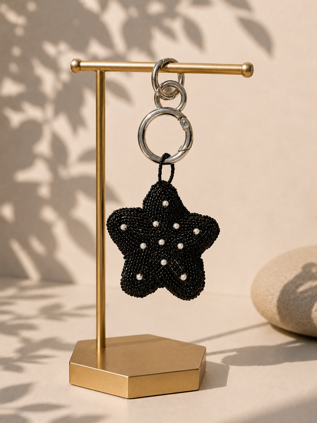Star charm hanging from silver-tone clasp