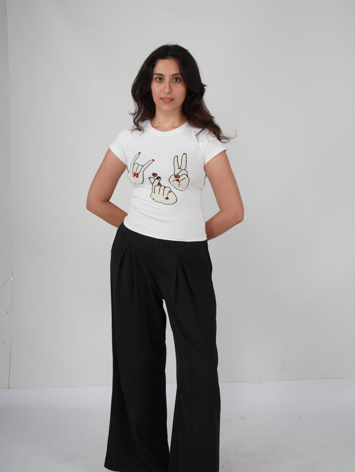Sarang Sign Top white cotton tee with hand-embroidered hand-sign artwork