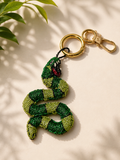 Beaded green snake charm with red mouth