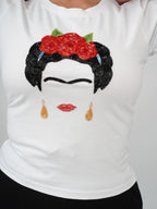 Still, I Rise Top white tee showcasing intricate hand embroidery